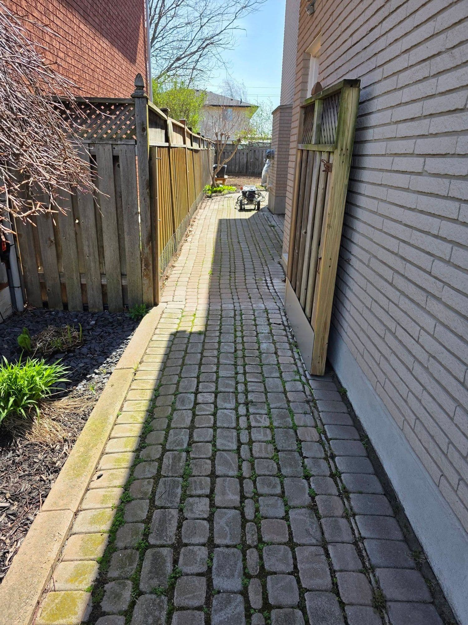 Interlock stone walkway between two homes