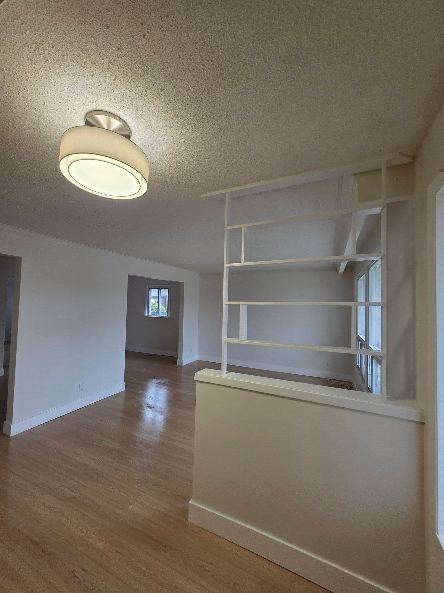 Refinished living space with a built-in room divider